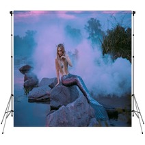A Beautiful Mermaid Is Sitting On The Rock In The Purple Fog Backdrops 217907479