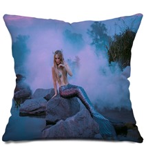 A Beautiful Mermaid Is Sitting On The Rock In The Purple Fog Pillows 217907479