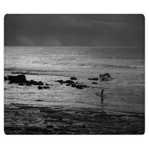 A Black And White Photo Of A Surfer Entering The Water At Golf Course Reef At Mollymook On The South Coast Of New South Wales In Australia Rugs 166523475