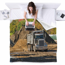 A Dump Truck About To Unload A Pile Of Dirt Blankets 36585640