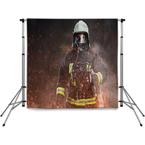 A Firefighter Dressed In A Uniform In A Studio Backdrops 192482883