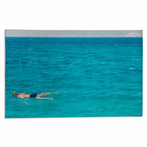 A Man Swims With A Mask Rugs 144065556