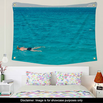 A Man Swims With A Mask Wall Art 144065556