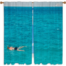 A Man Swims With A Mask Window Curtains 144065556