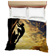 A Silhouette Of Man Climbing On Mountain At Sunset. Adrenaline Bedding 61621308