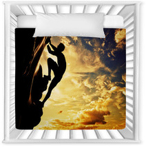 A Silhouette Of Man Climbing On Mountain At Sunset. Adrenaline Nursery Decor 61621308
