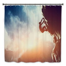 A Silhouette Of Man Climbing On Rock, Mountain At Sunset. Bath Decor 62334793