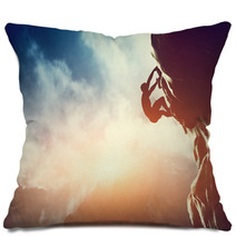 A Silhouette Of Man Climbing On Rock, Mountain At Sunset. Pillows 62334793