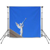 A White Statue Of A Winged Troubadour Backdrops 42461366
