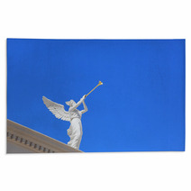 A White Statue Of A Winged Troubadour Rugs 42461366