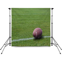 American Rugby Ball On The Grass Backdrops 55617488