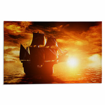 Ancient Pirate Ship Sailing On The Ocean At Sunset Rugs 66004091