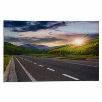 Asphalt Road In Mountains At Sunset Rugs 67347786