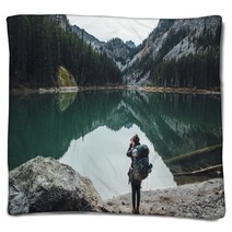 Backpacker Taking Picture Of Teal Lake Blankets 174363687