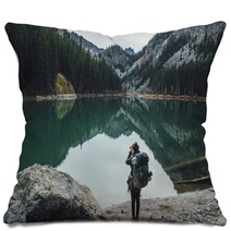 Backpacker Taking Picture Of Teal Lake Pillows 174363687