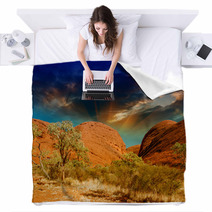 Beautiful Rocks Of Australian Outback Against Colourful Sky Blankets 56334986