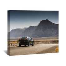 Black Sports Car On A Desert Road Wall Art 144227904