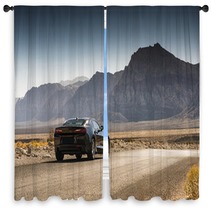 Black Sports Car On A Desert Road Window Curtains 144227904