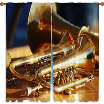 Blowing Brass Wind Instrument On Table Window Curtains 63942563