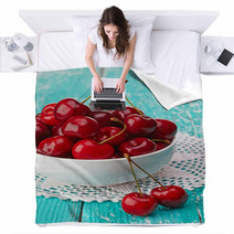 Bowl Of Fresh Red Cherries On Blue Wooden Background Blankets 54075358