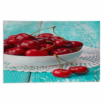 Bowl Of Fresh Red Cherries On Blue Wooden Background Rugs 54075358