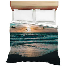 Bright Sun Rising In The Colorful Sky Over Dark Sand And Waves Bedding 176183048