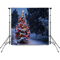 Brightly Lit Snow Covered Holiday Christmas Tree Winter Storm Backdrops 54236814