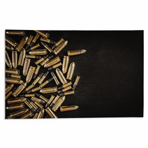 Bullets From The Gun Placed On A Black Wooden Table Rugs 130223035