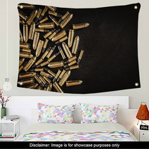 Bullets From The Gun Placed On A Black Wooden Table Wall Art 130223035