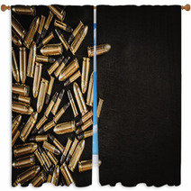Bullets From The Gun Placed On A Black Wooden Table Window Curtains 130223035