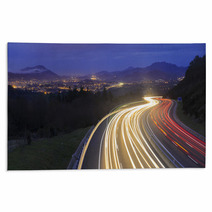 Car Lights At Night On The Road Going To The City Rugs 79106256