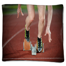 Close-up Image Of A Female Runner Leaving The Starting Blocks Blankets 46138963
