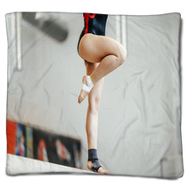 Competition In Artistic Gymnastics Female Gymnast Exercises On Balance Beam Blankets 142927808