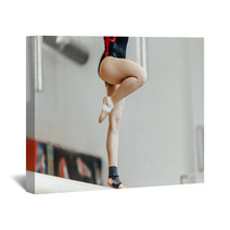 Competition In Artistic Gymnastics Female Gymnast Exercises On Balance Beam Wall Art 142927808