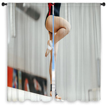 Competition In Artistic Gymnastics Female Gymnast Exercises On Balance Beam Window Curtains 142927808