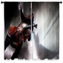 Concert Photo Of Man Playing Cello With Background Lights Window Curtains 68519896