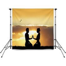Couple Doing Yoga At Sunset Backdrops 101625377