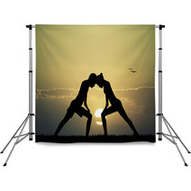 Couple Doing Yoga At Sunset Backdrops 67438412