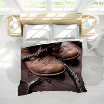 Cowboy Boots Whip And Spurs On Wood Bedding 38875711