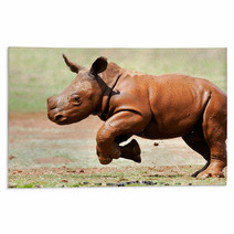 Cute Baby Wild White Rhino Running Through The Mud Rugs 65856039