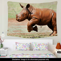 Cute Baby Wild White Rhino Running Through The Mud Wall Art 65856039