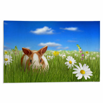 Cute Fluffy Bunny Beside A Flower Hiding On Grass Rugs 32612532
