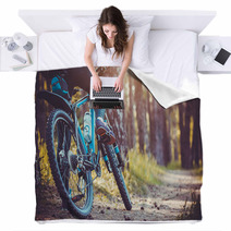 Cyclist Riding Mountain Bike In The Forest Blankets 111837211