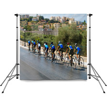 Cyclists During The Race On City Street Backdrops 96912565