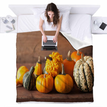 Decorative Mini Pumpkins On Wooden Background Blankets 68792564