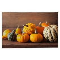 Decorative Mini Pumpkins On Wooden Background Rugs 68792564