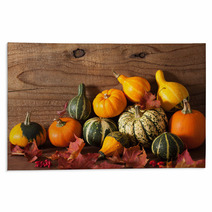 Decorative Mini Pumpkins On Wooden Background Rugs 68792573