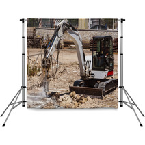 Excavator With Hammer Engaged In Excavation Of Foundation Backdrops 56589103