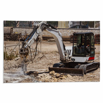 Excavator With Hammer Engaged In Excavation Of Foundation Rugs 56589103