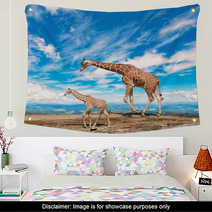  Family Of Giraffes Goes Against The Blue Sky Wall Art 57876421